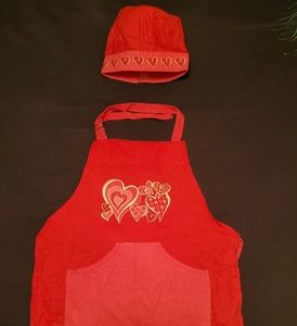 Little girl cooking apron and bakers hat